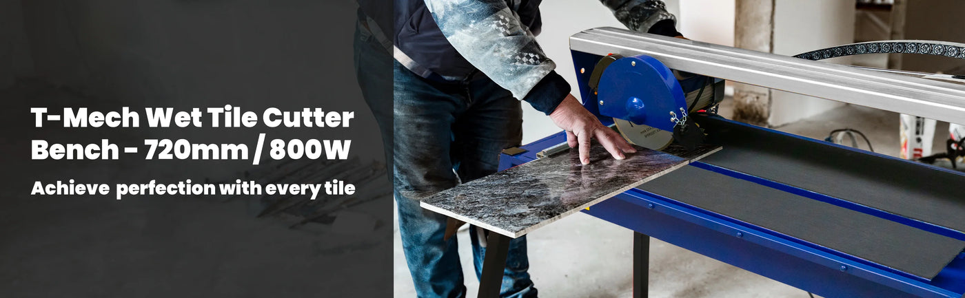 T-Mech wet tile cutter bench with a blue blade cutting a large, textured tile on a sturdy work surface, ideal for precision tile work