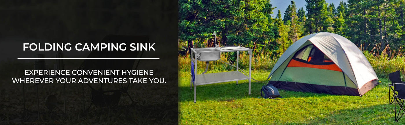 Folding camping sink with stainless steel basin beside a colorful tent on green grass, ideal for outdoor hygiene and convenience