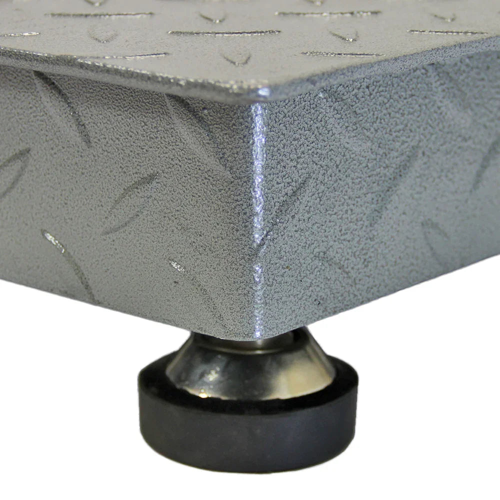 Heavy-duty industrial pallet weighing scales with a textured gray surface and sturdy rubber feet for stability and durability
