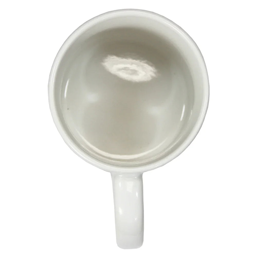 Top view of a plain white ceramic mug with a rounded handle and smooth interior surface.