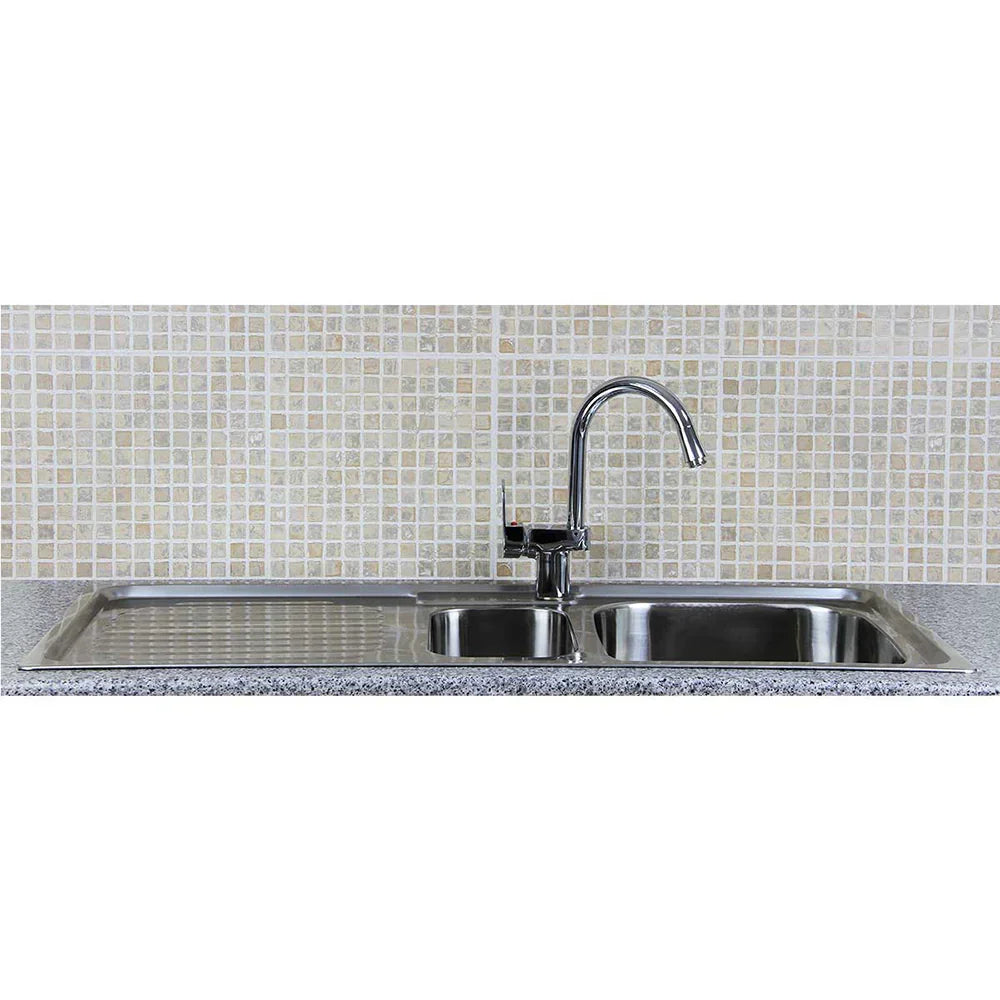 Premium stainless steel kitchen sink with dual basins, sleek confetti tap, and textured granite countertop against a mosaic tile backsplash