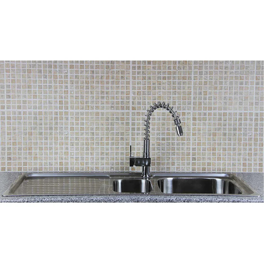 Kukoo steel sink with two compartments, featuring a sleek rainbow tap and a textured granite countertop against a mosaic tile backdrop