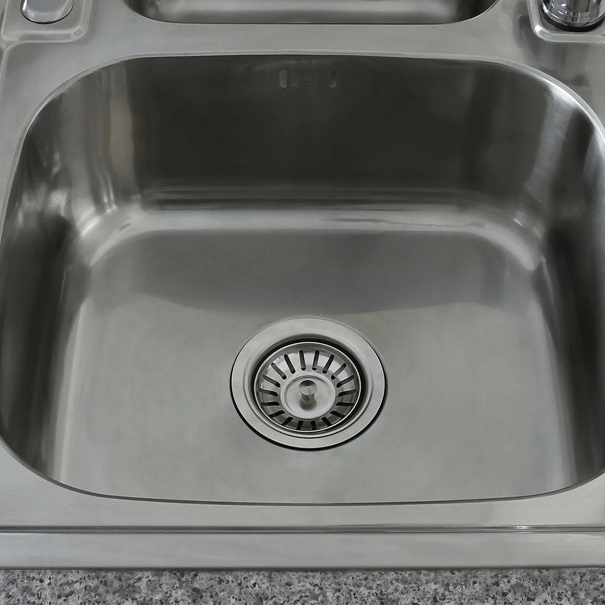 Premium stainless steel kitchen sink with a smooth, polished surface, deep basin, and a central drain for efficient water flow