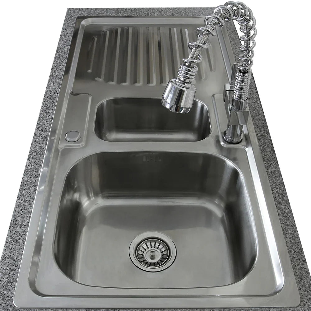 Premium stainless steel kitchen sink with a sleek design, featuring a spacious basin and a modern Padstow tap with a flexible spout