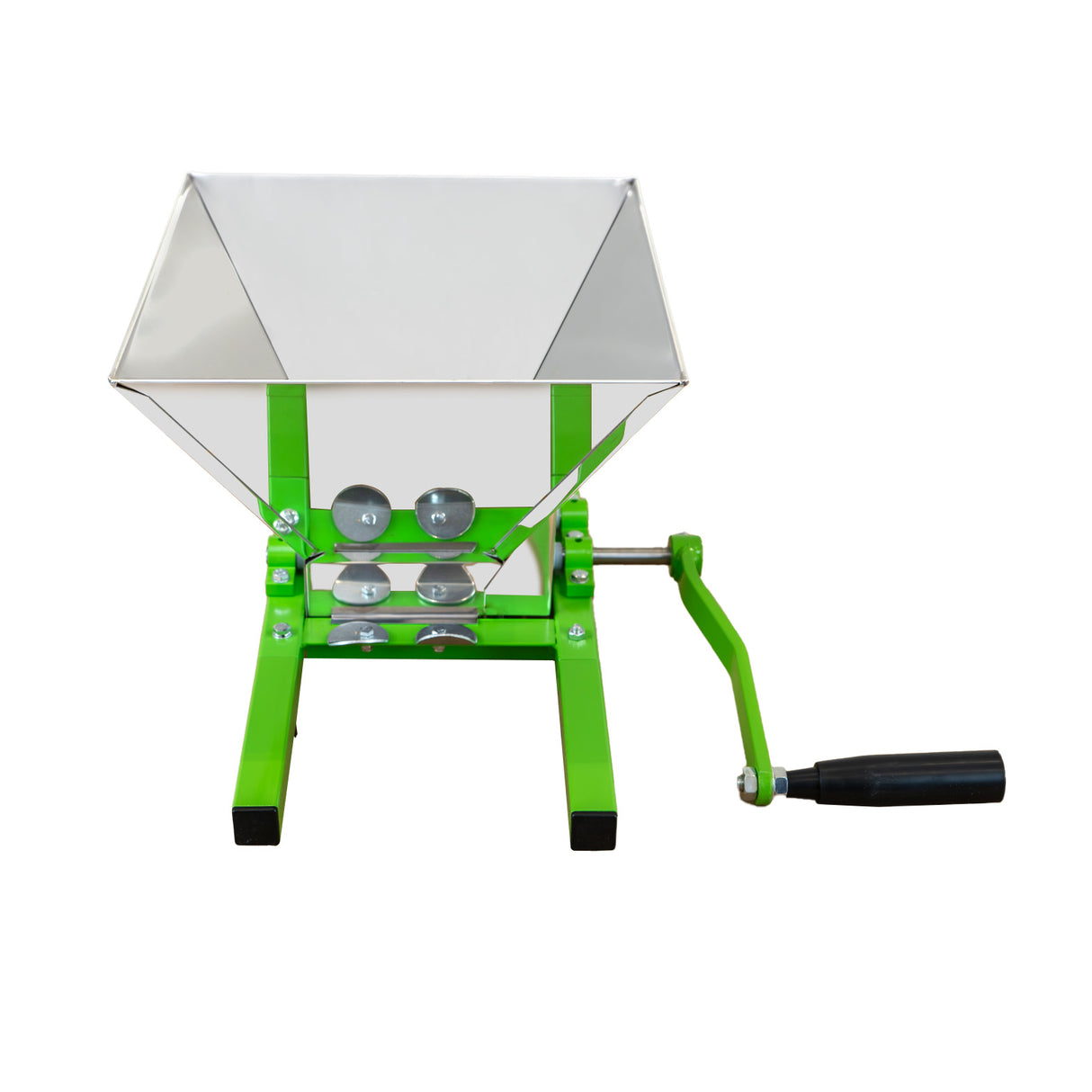 Green metal fruit crusher with a shiny stainless steel hopper, featuring a hand crank and sturdy base for efficient fruit processing