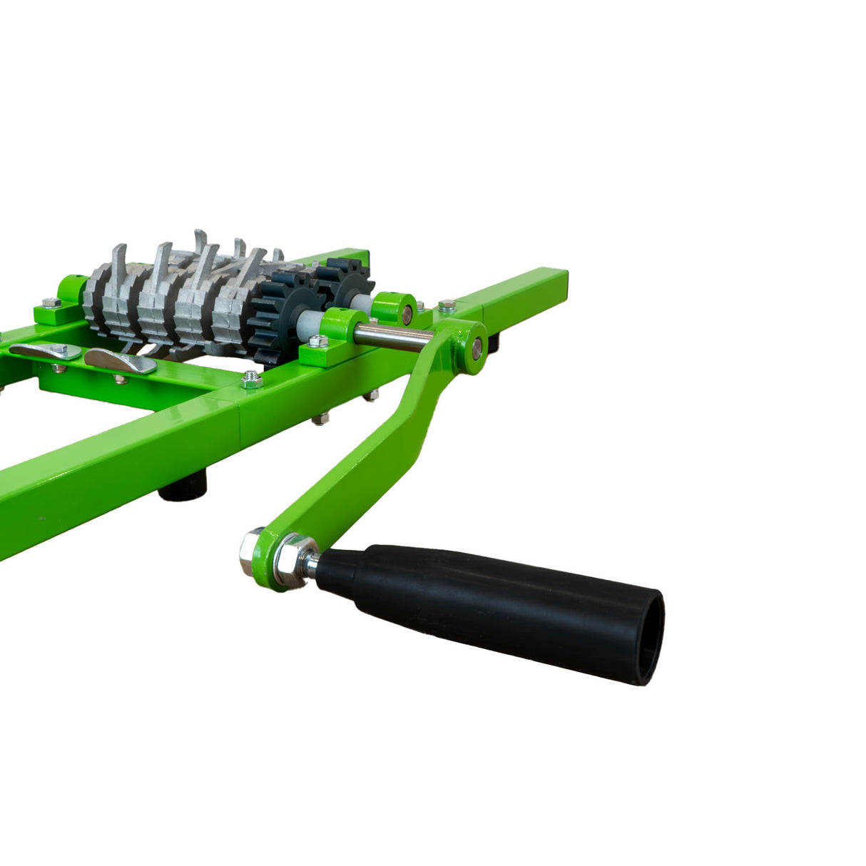 Green fruit crusher with a sturdy metal frame, textured rollers, and a black handle, designed for efficient fruit processing