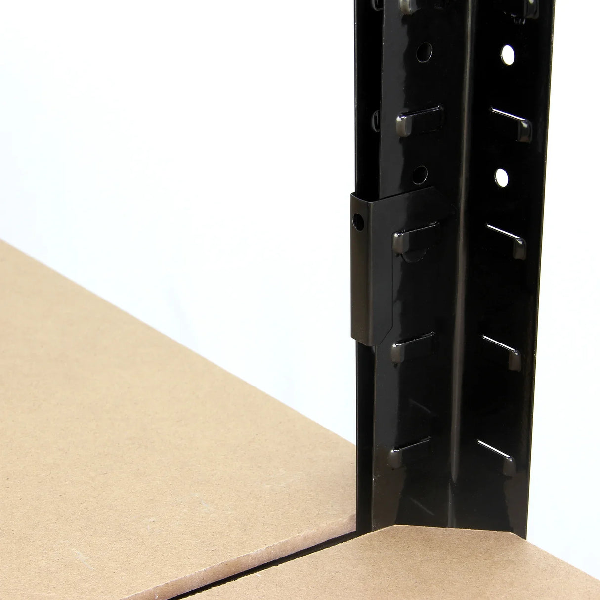 Black garage shelving bay connector clip securely fastened to a sturdy brown particle board shelf, enhancing stability and support