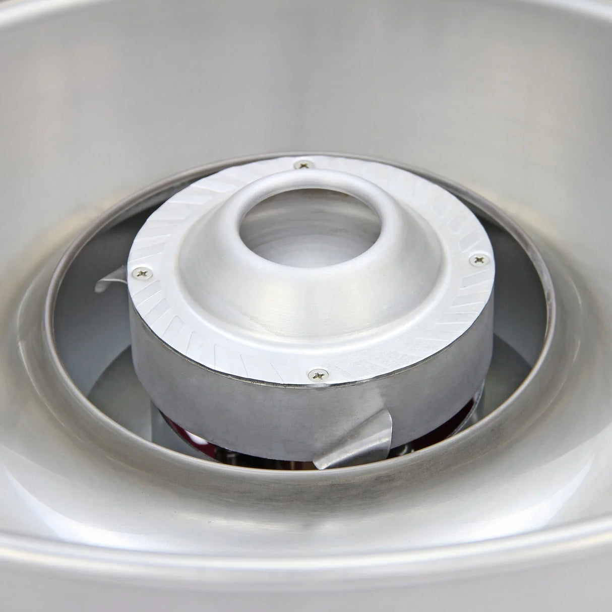 Stainless steel bowl interior of the KuKoo Candy Floss Making Machine, featuring a central sugar chamber and smooth, polished finish