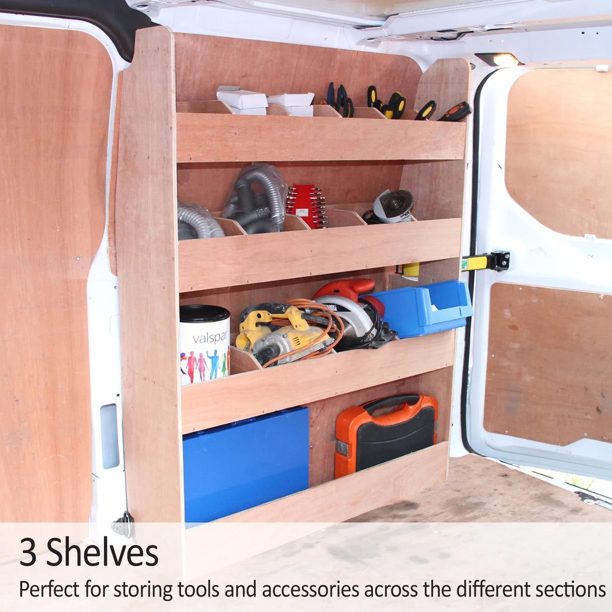 Wooden shelving unit with three shelves inside a Ford Transit Custom van, organized with tools, accessories, and storage boxes