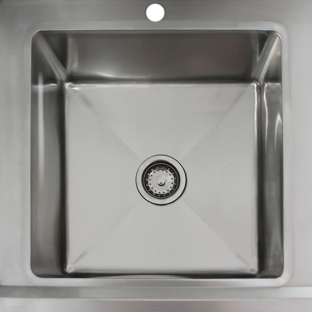 Stainless steel commercial sink with a square basin, central drain, and polished finish, designed for efficient pre-rinsing