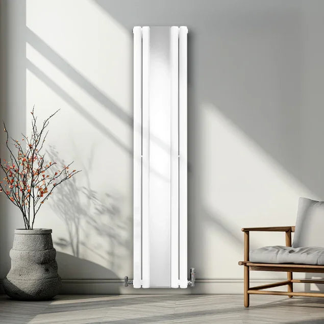 Sleek white oval mirror radiator with valves, 1800mm x 380mm, mounted on a wall in a modern living space with natural light