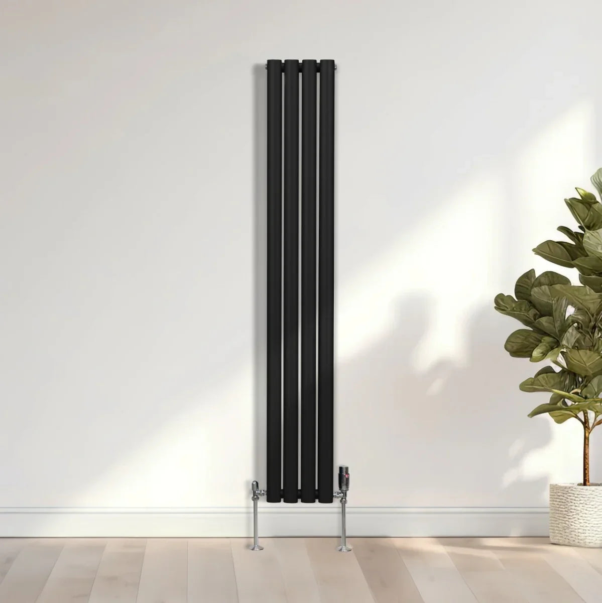 Sleek black oval column radiator, 1600mm x 240mm, featuring a modern design with vertical lines and chrome valves against a light wall