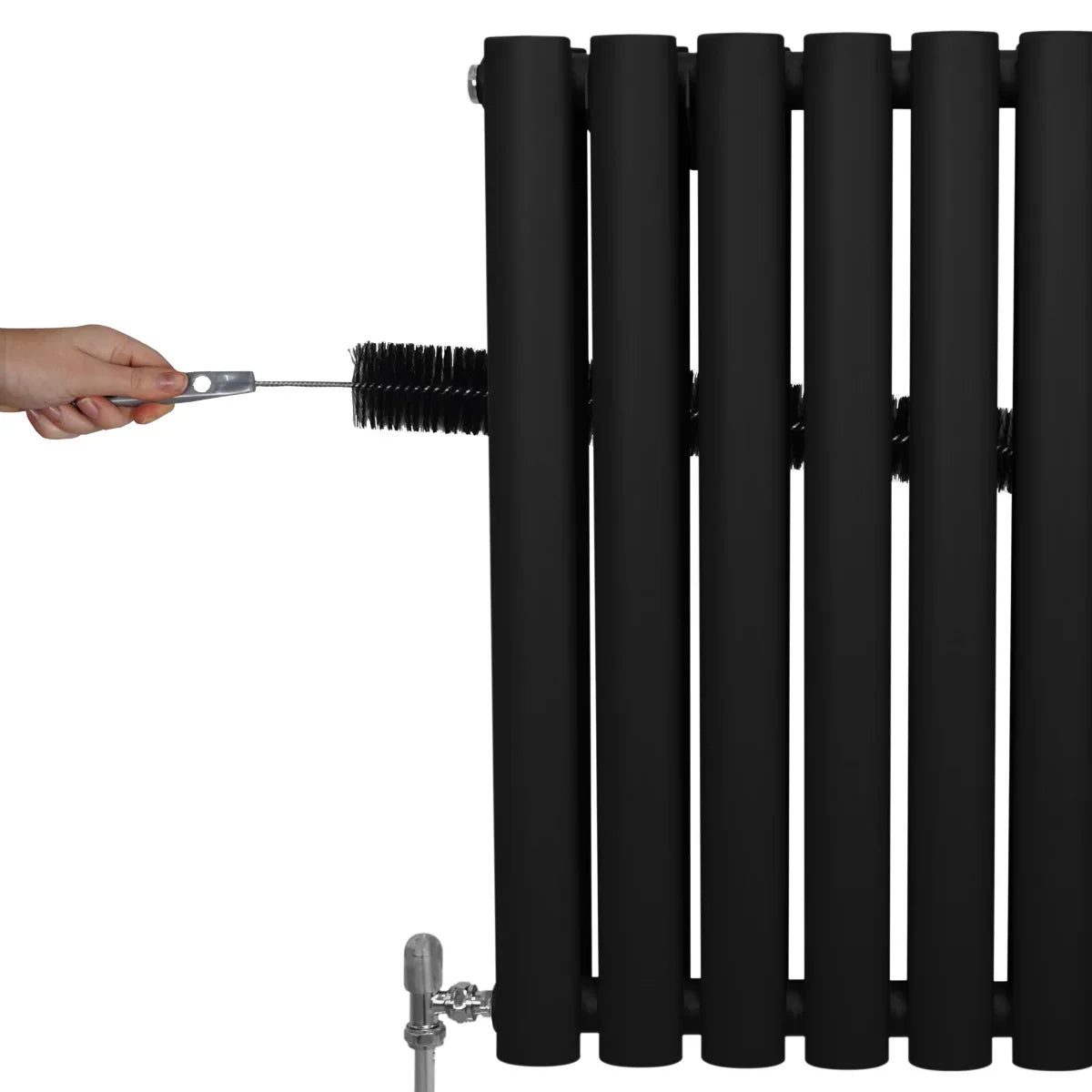 Black oval column radiator with six rounded sections, showcasing a hand adjusting the valve for temperature control