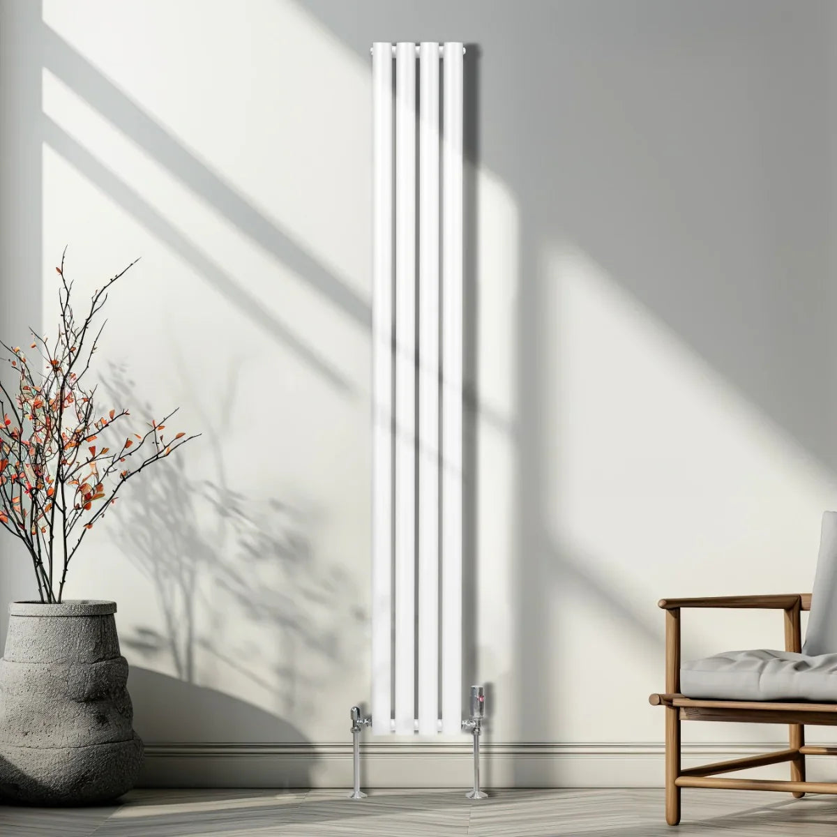 Sleek white oval column radiator with four vertical panels, mounted on silver feet, enhancing a modern interior space