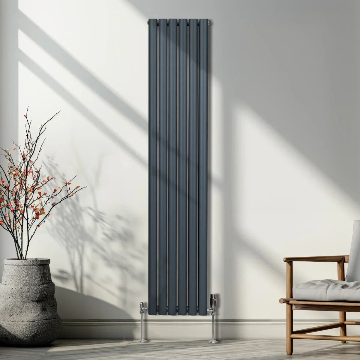 Oval column radiator in anthracite grey, 1800mm x 360mm, featuring sleek vertical lines and modern chrome valves, set against a bright interior