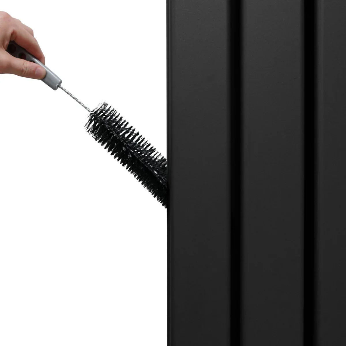 Black flat mirror radiator with a hand using a cleaning brush, showcasing sleek design and textured surface for easy maintenance