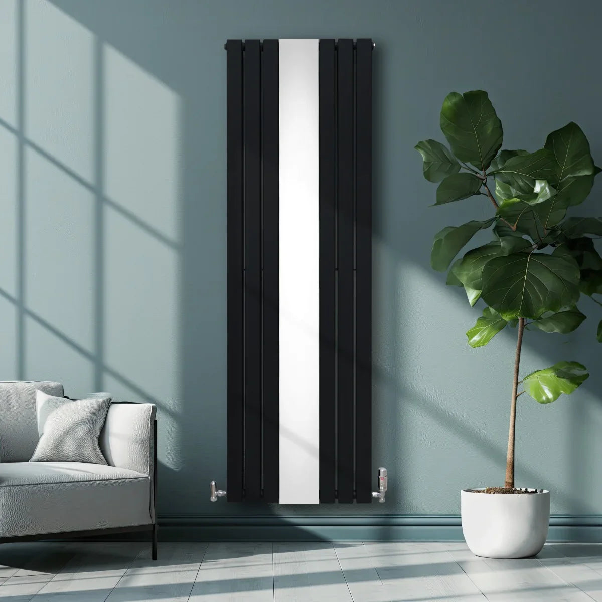 Sleek black flat mirror radiator with vertical lines, measuring 1800mm x 565mm, mounted on a stylish wall beside a modern sofa and plant