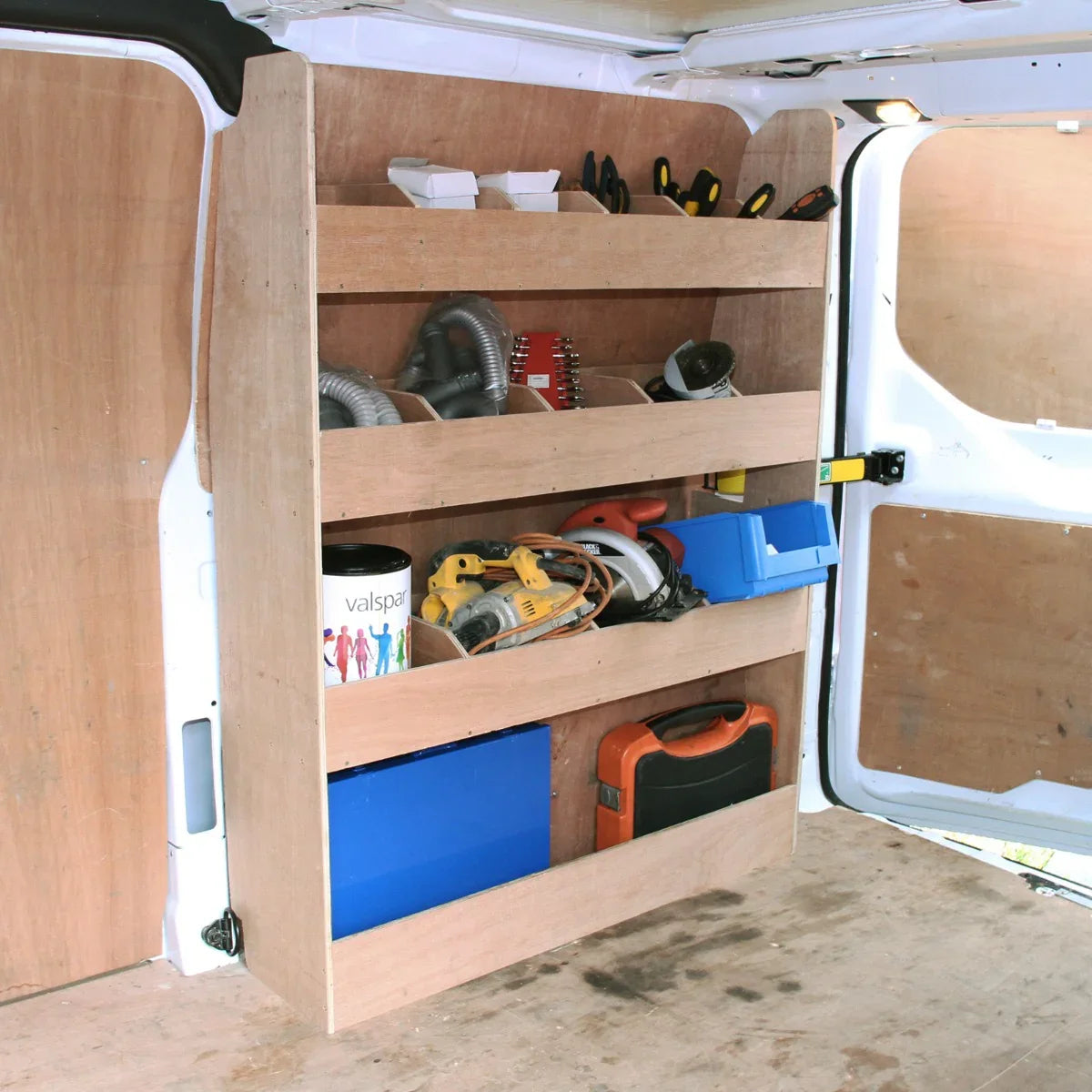 Ford Transit Custom divider racking features sturdy wooden shelves, organized tools, and a toolbox, enhancing van storage efficiency