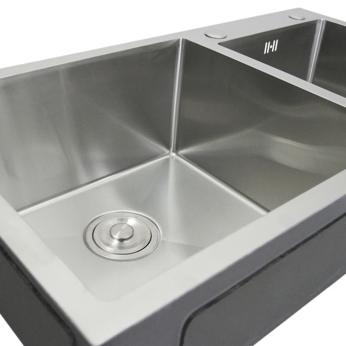 Double stainless steel sink with a sleek, polished finish, featuring two spacious basins and a central drain for efficient water flow