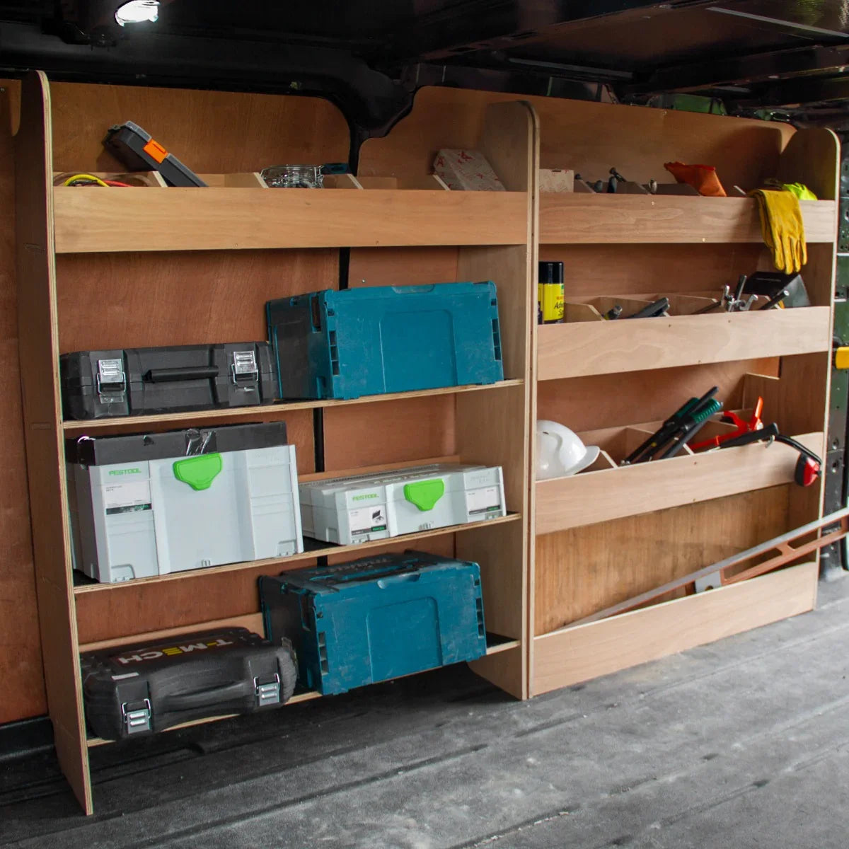 Ford Transit Custom divider racking with wooden shelves, featuring organized toolboxes, equipment, and storage for efficient van use
