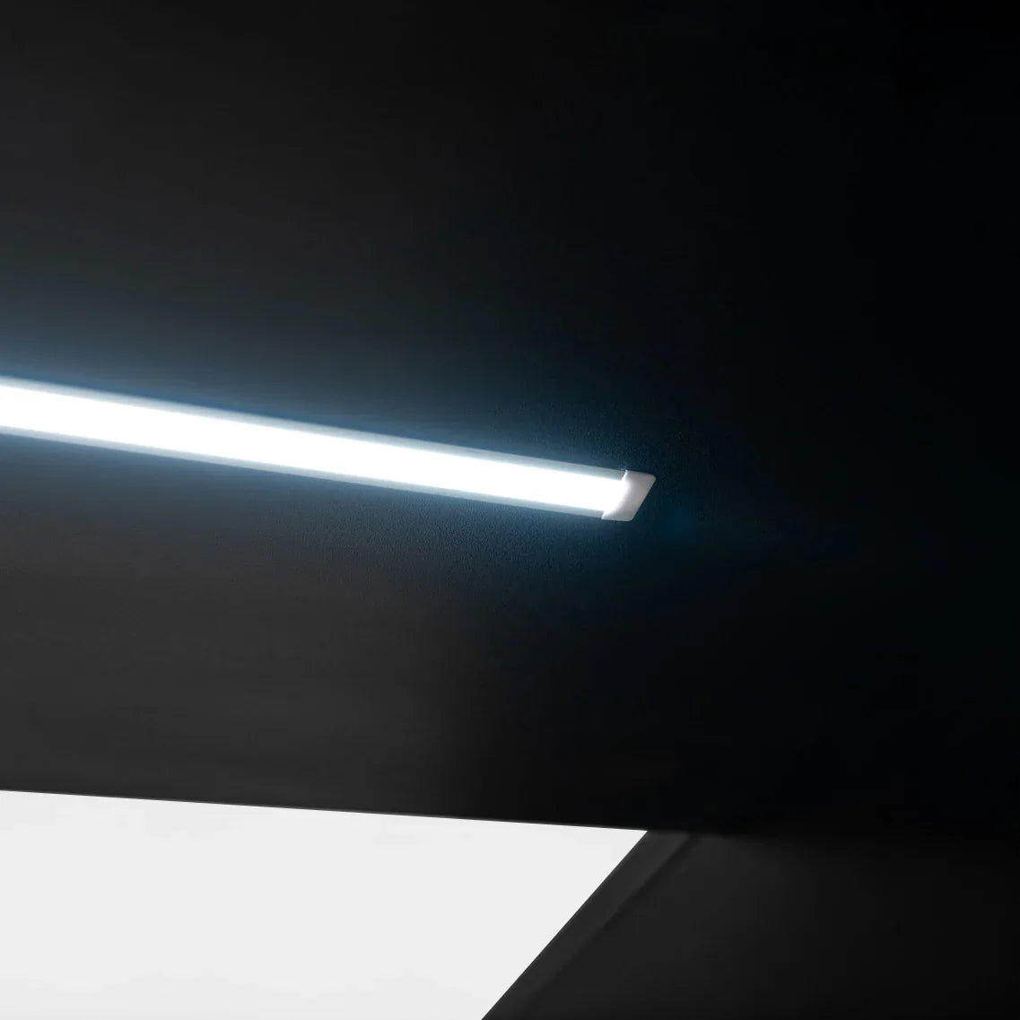 Sleek black LED retail shop counter C900 featuring a modern design with a bright, energy-efficient light strip for enhanced visibility