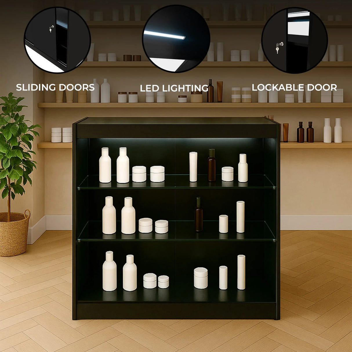 Black LED retail shop counter K900 with sliding doors, lockable door, and illuminated shelves displaying various white containers