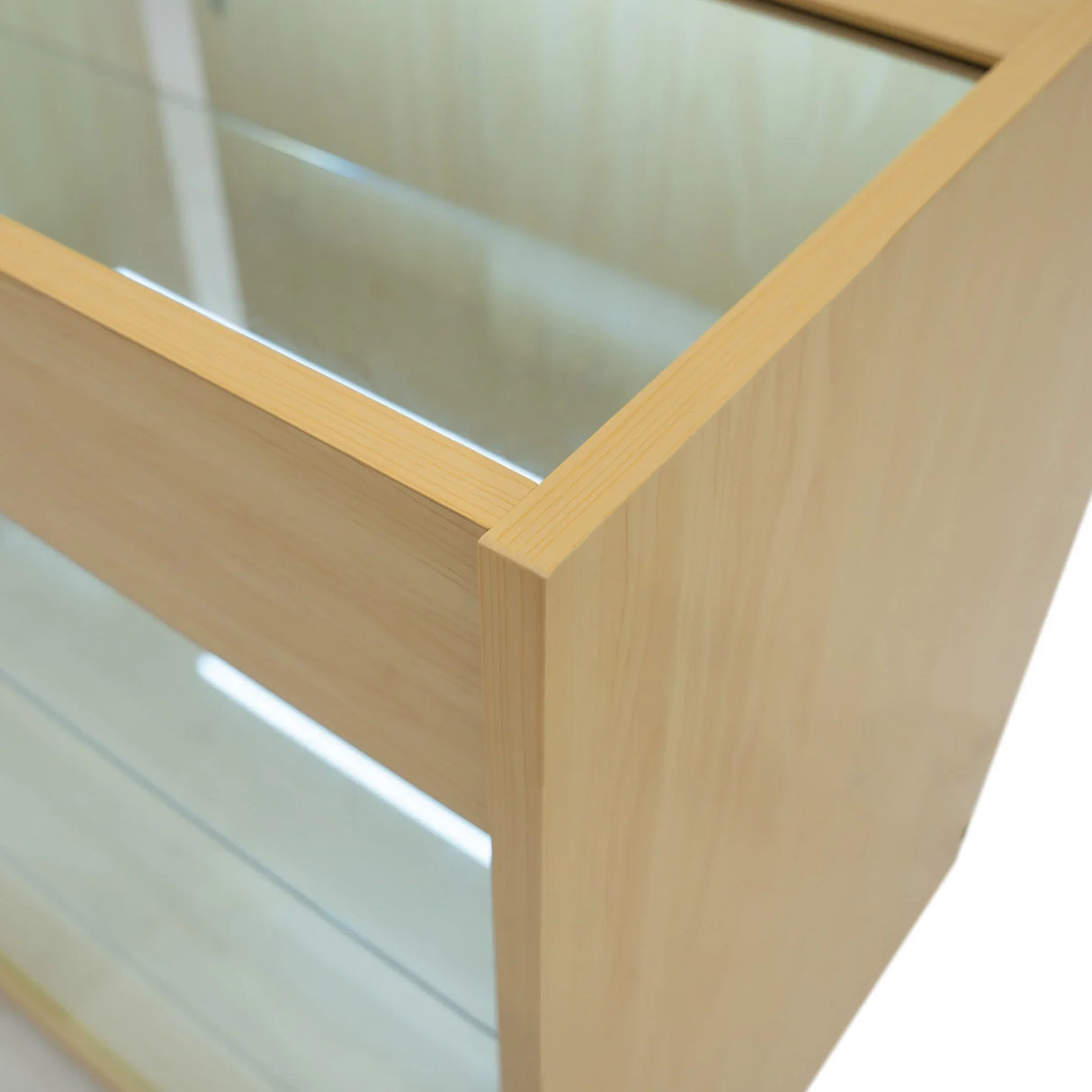 Maple LED retail shop counter K900 with a sleek design, featuring glass shelves and smooth, natural wood finish