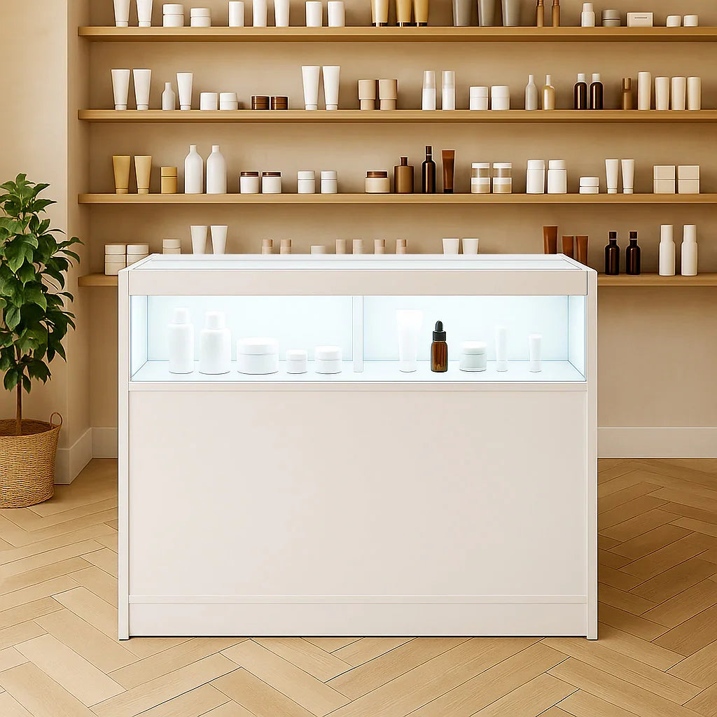 LED retail shop counter B1200 in white with illuminated display, showcasing various skincare products against a minimalist backdrop