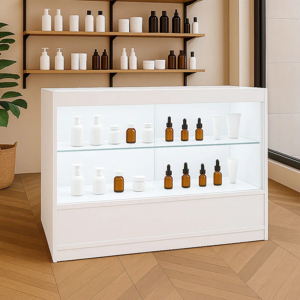 LED retail shop counter C1200 in white with glass shelves displaying various bottles and jars, set in a modern interior with wooden accents