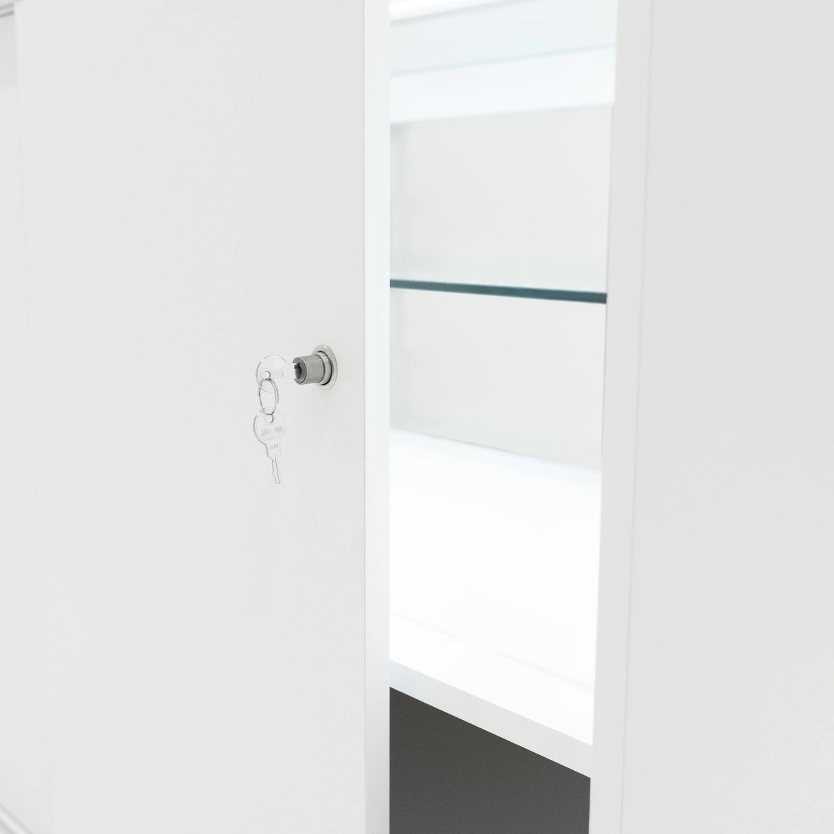 White LED retail shop counter C1200 featuring an open door, key lock, and sleek shelves for organized display storage