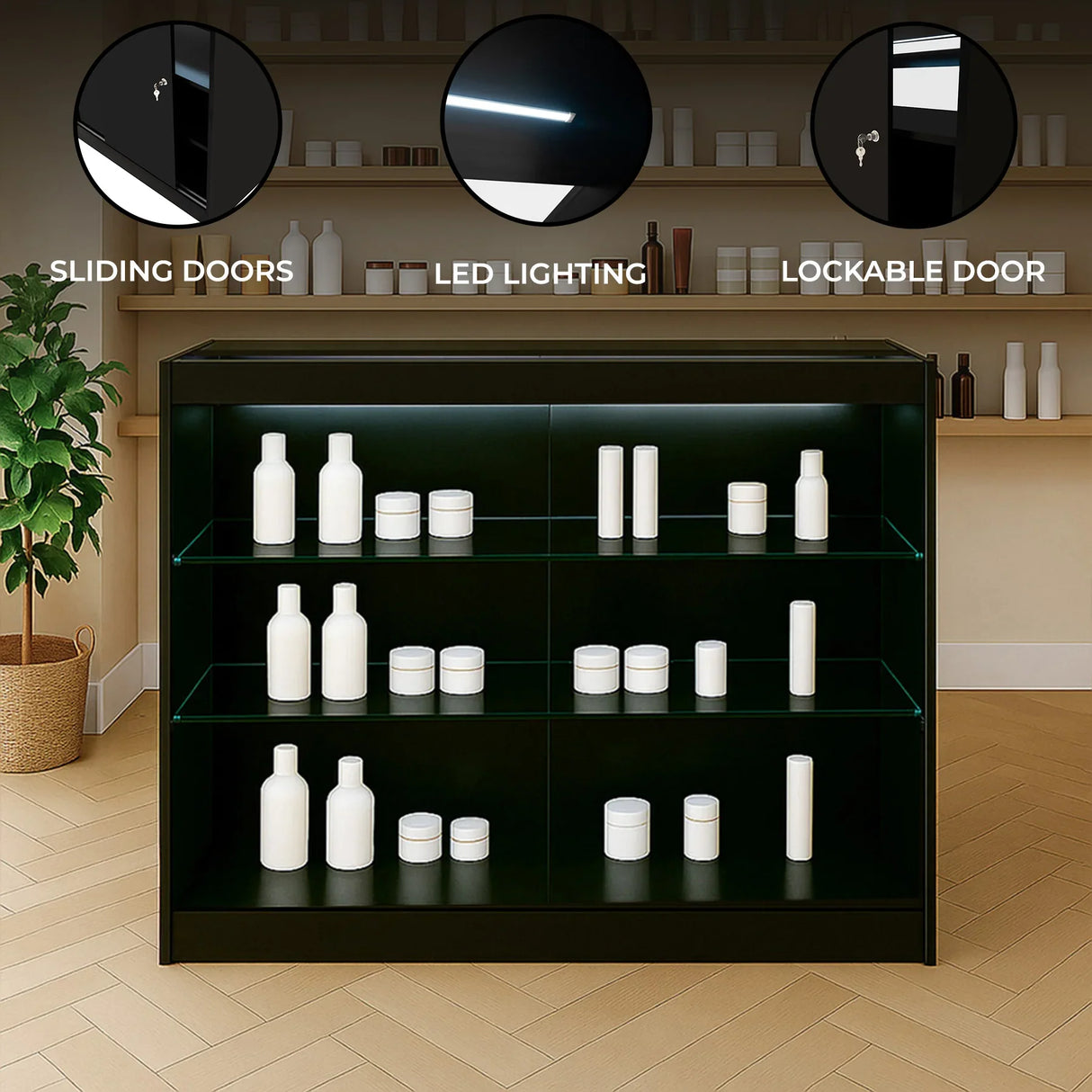 Black LED retail shop counter K1200 with sliding doors, lockable design, and illuminated shelves displaying white bottles