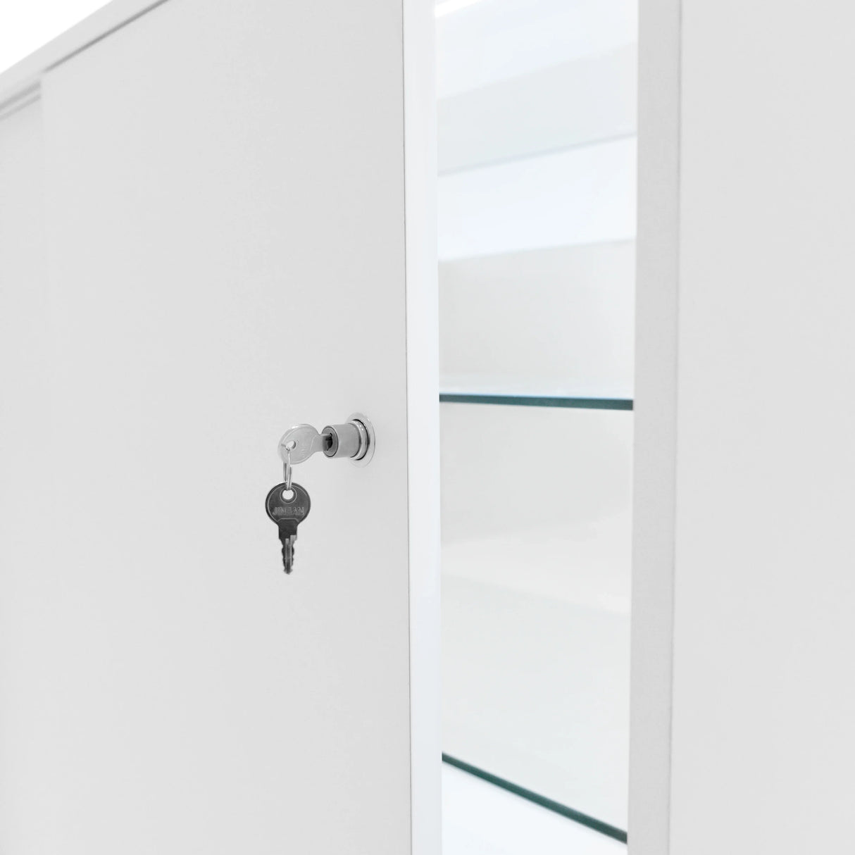 White LED retail shop counter K1200 featuring a secure lock with key, sleek design, and glass shelves for display