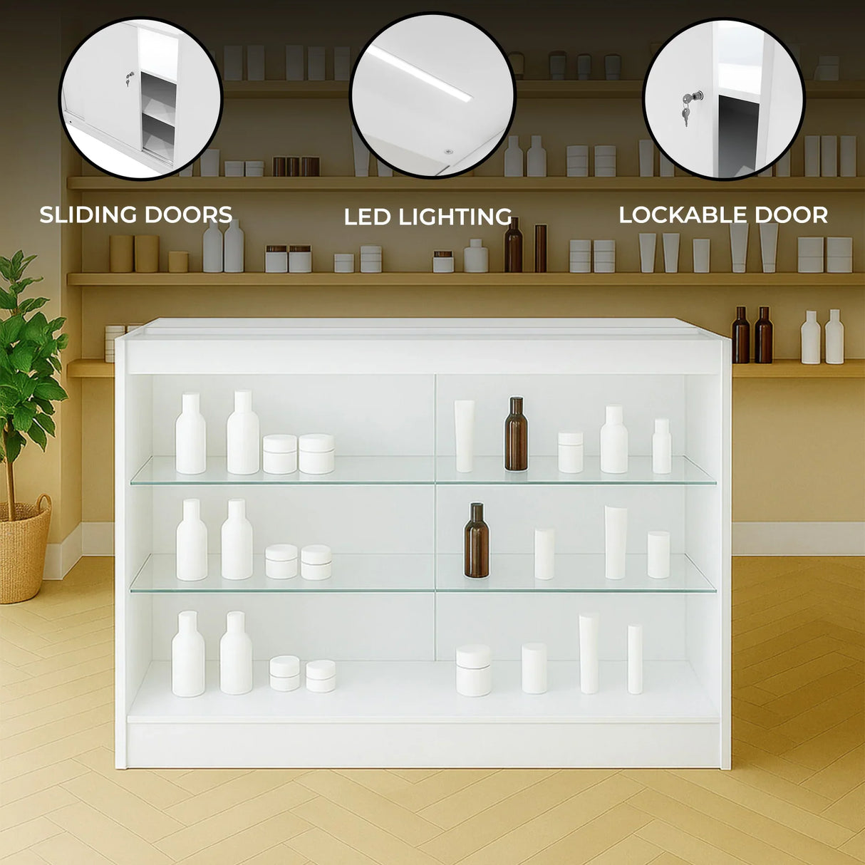 White LED retail shop counter K1200 with sliding glass doors, lockable door, and illuminated shelves displaying various bottles