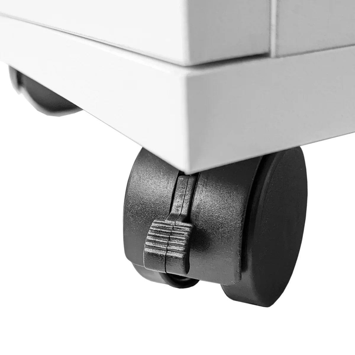 Close-up of a black rolling caster wheel on a sleek white professional manicure table, showcasing sturdy design and mobility