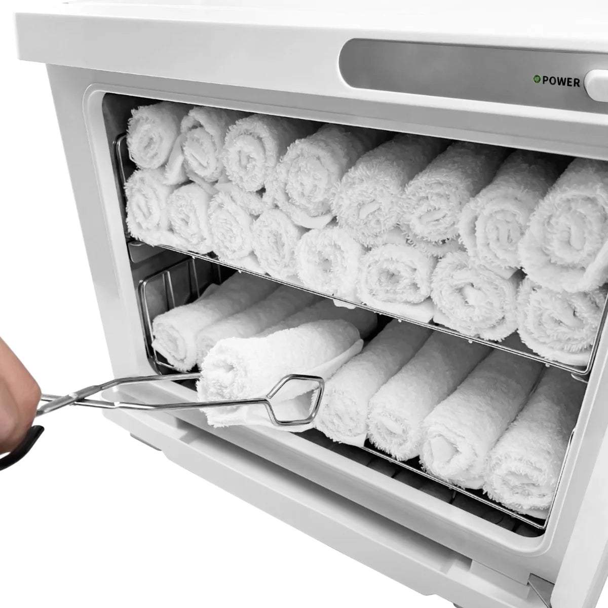 White Hot Towel Warmer with neatly stacked white towels, featuring a sleek design and a hand using tongs to retrieve a towel