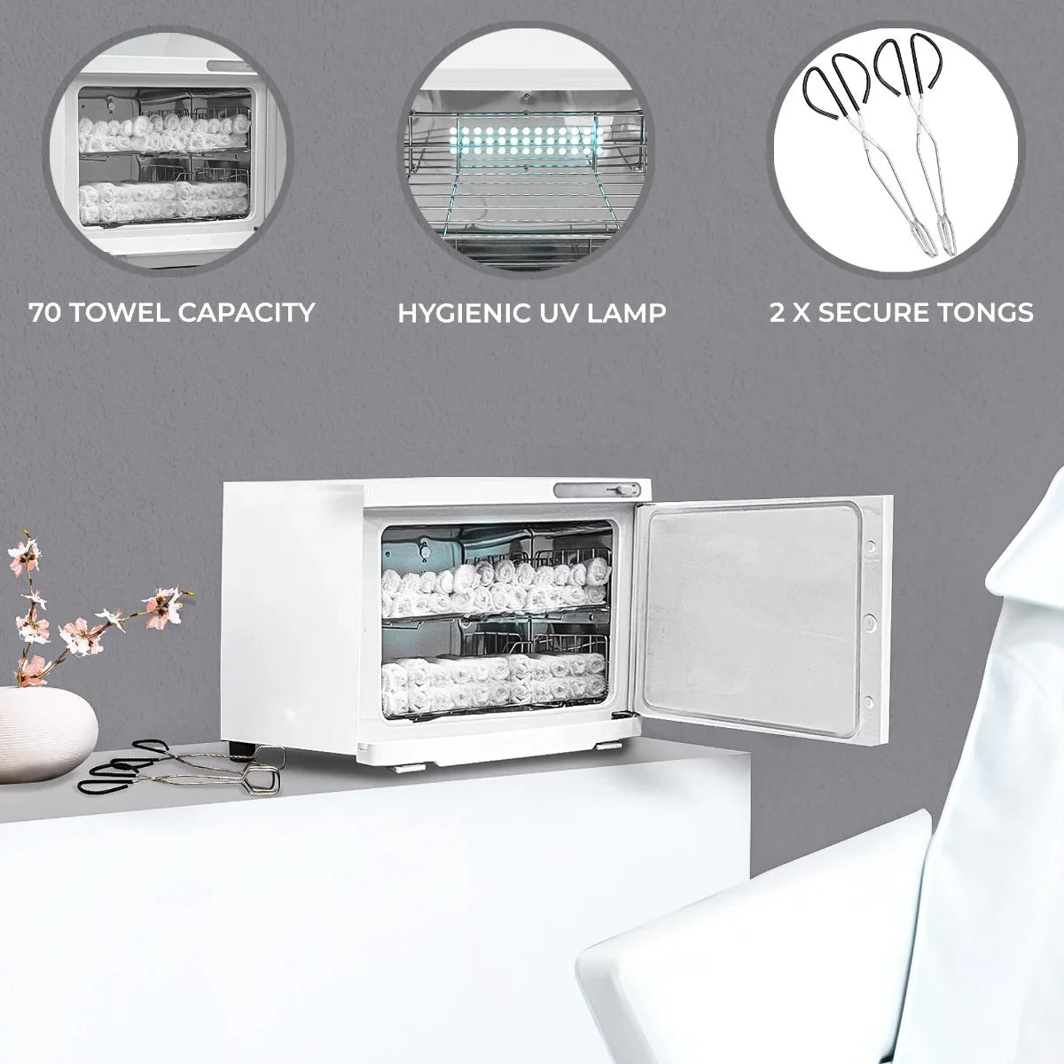 White Hot Towel Warmer with open door, showcasing 70 towel capacity, hygienic UV lamp, and included secure tongs on a sleek surface