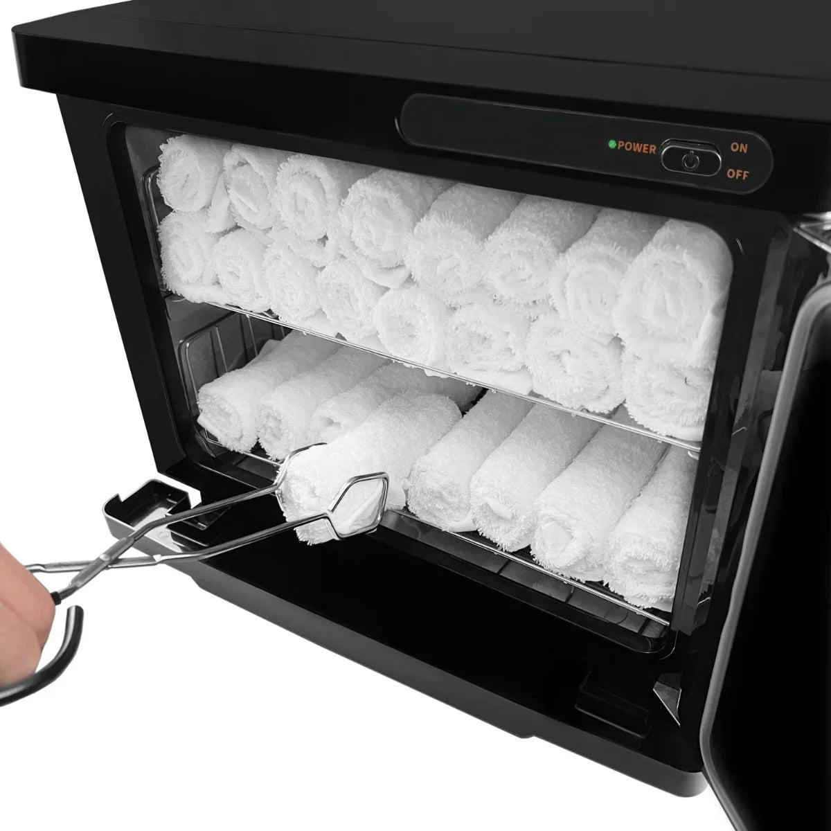 Black hot towel warmer with a sleek design, featuring neatly stacked white towels inside and a user-friendly control panel