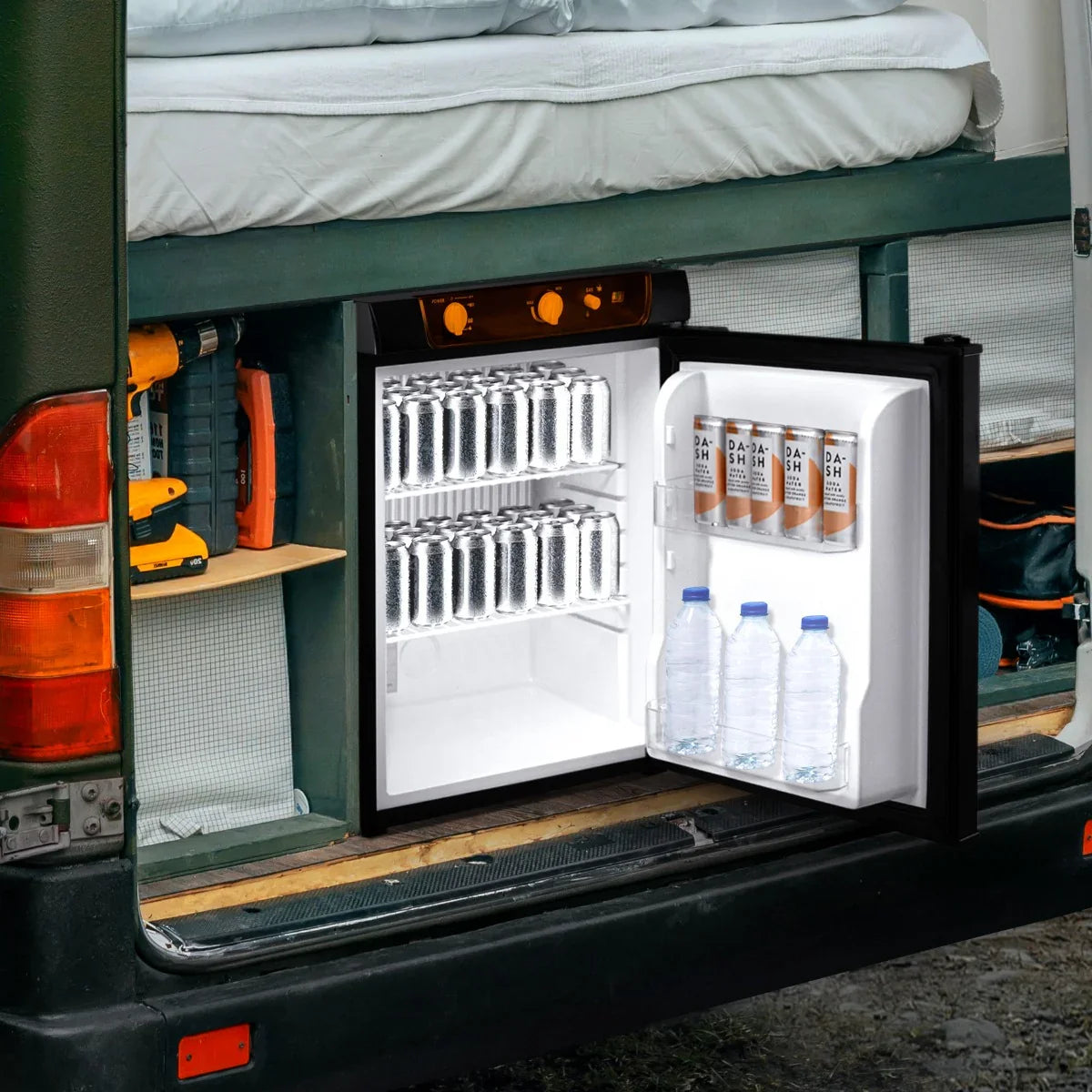 Compact 3-way absorption fridge with a sleek black exterior, featuring clear shelves holding cans and bottles, ideal for camping or travel