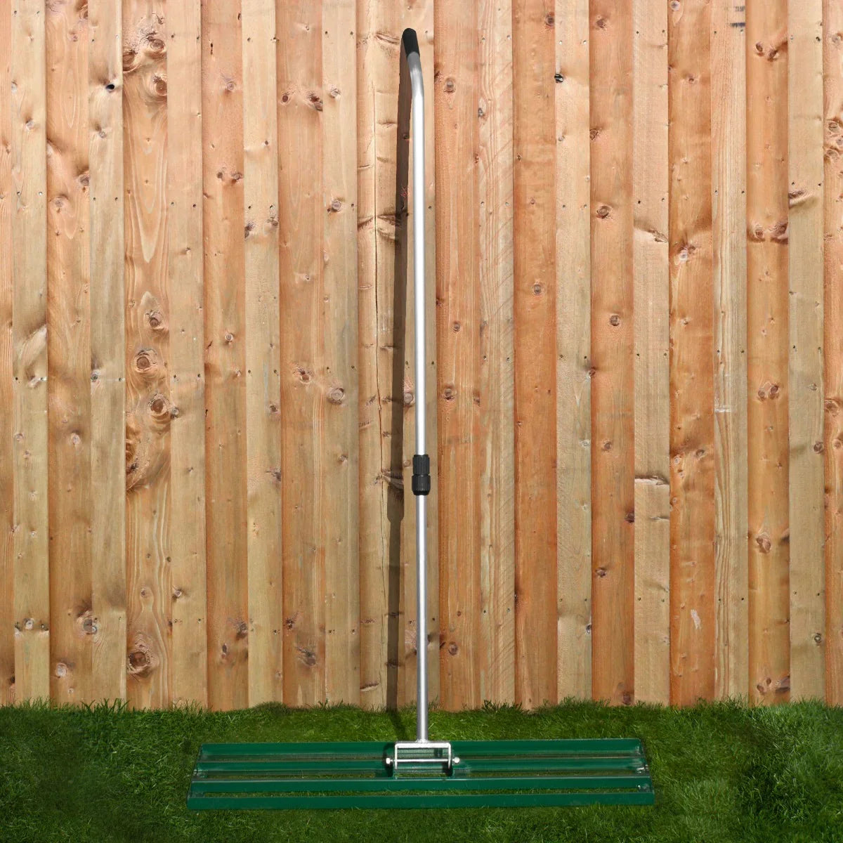 T-Mech Lawn Leveller 100cm in green with a sturdy aluminum handle, designed for smoothing and leveling soil in gardens