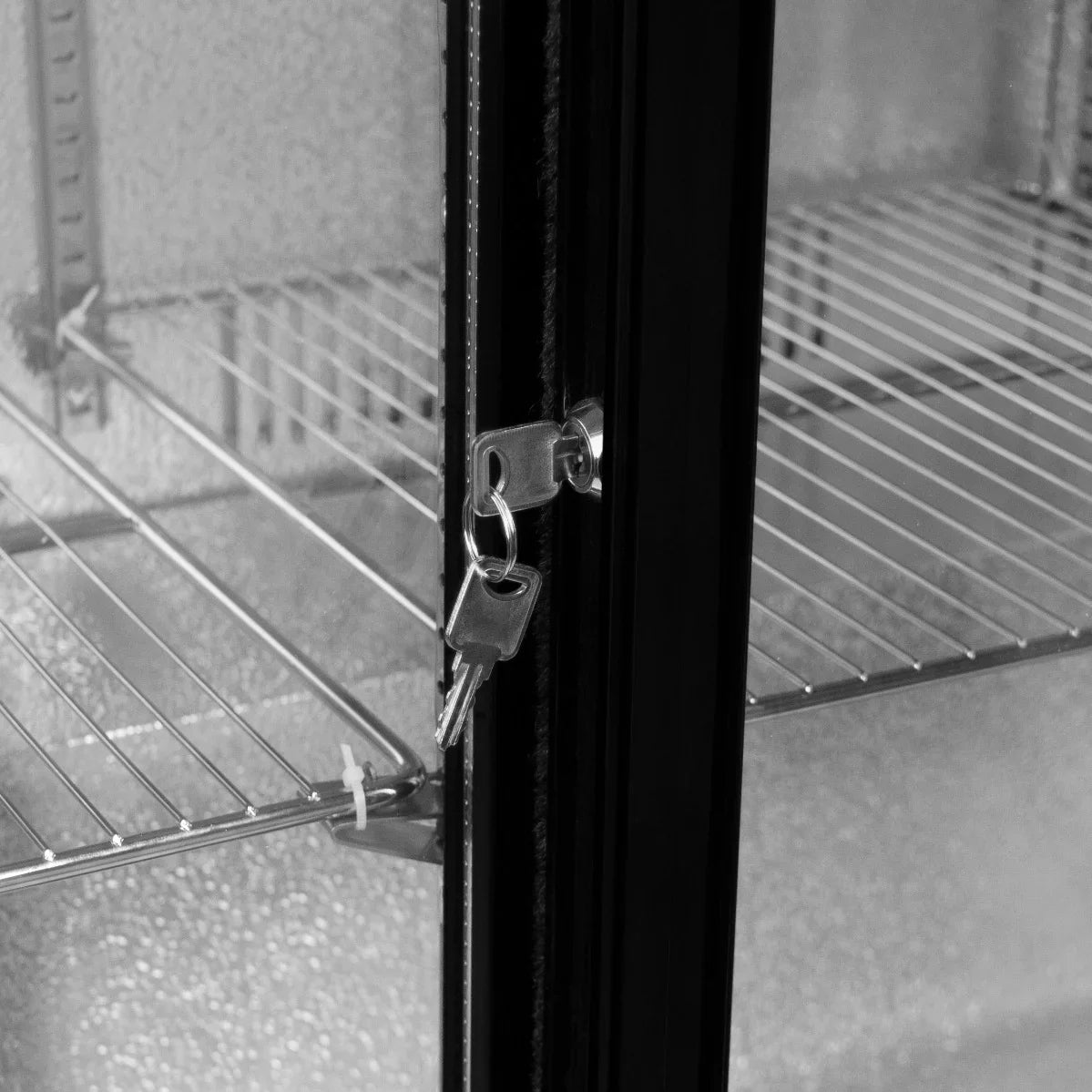 Sliding double door back bar fridge cooler with metal shelves, featuring a secure lock and sleek black finish for modern storage