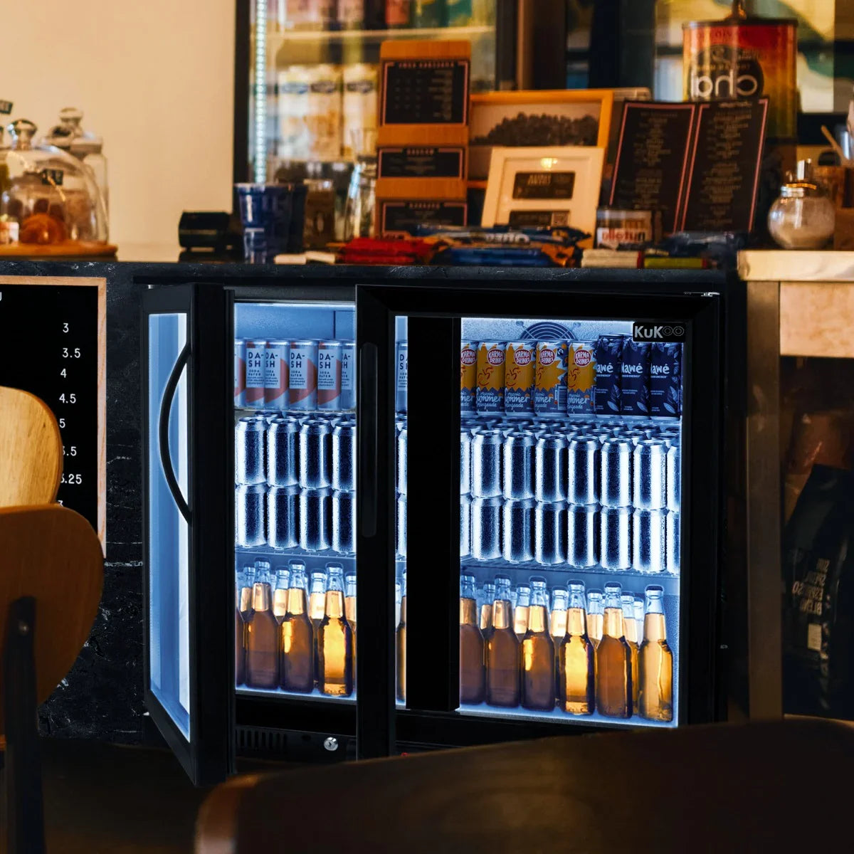 Hinged double door back bar fridge cooler displaying a variety of beverages, featuring sleek black design and bright interior lighting