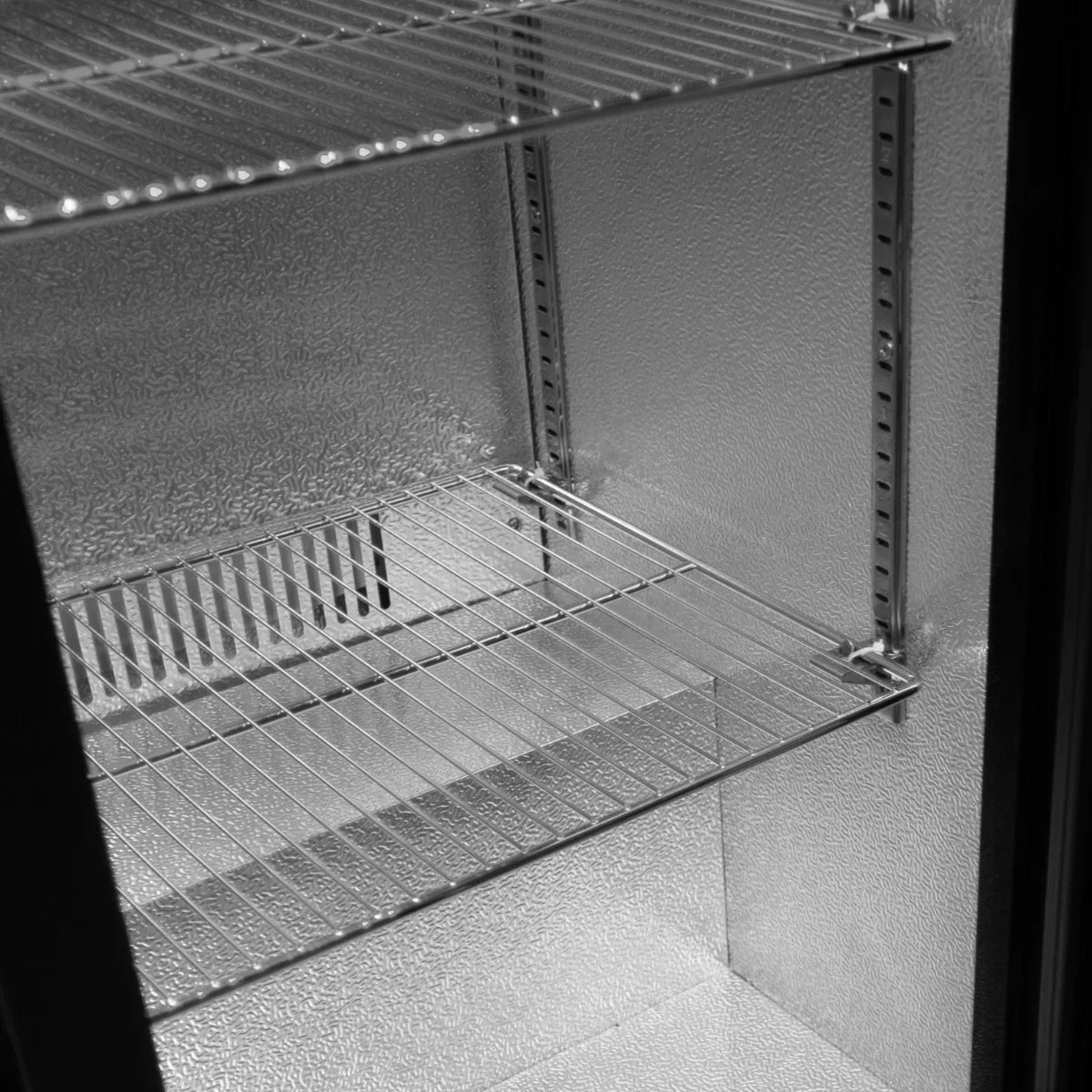 Hinged double door back bar fridge cooler with spacious interior, metal wire shelves, and textured silver interior finish