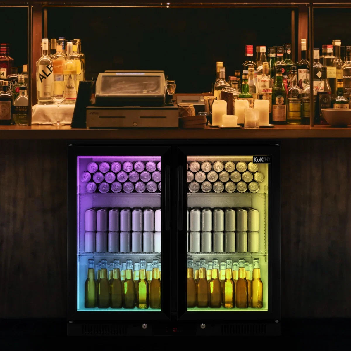 Hinged double door back bar fridge cooler with colorful LED lighting, showcasing neatly arranged cans and bottles of various beverages