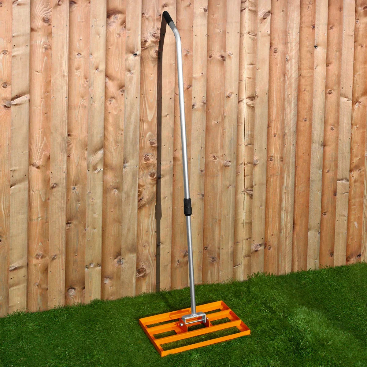 T-Mech Lawn Leveller 50cm in bright orange with a sturdy aluminum handle, designed for smoothing and leveling soil or grass surfaces