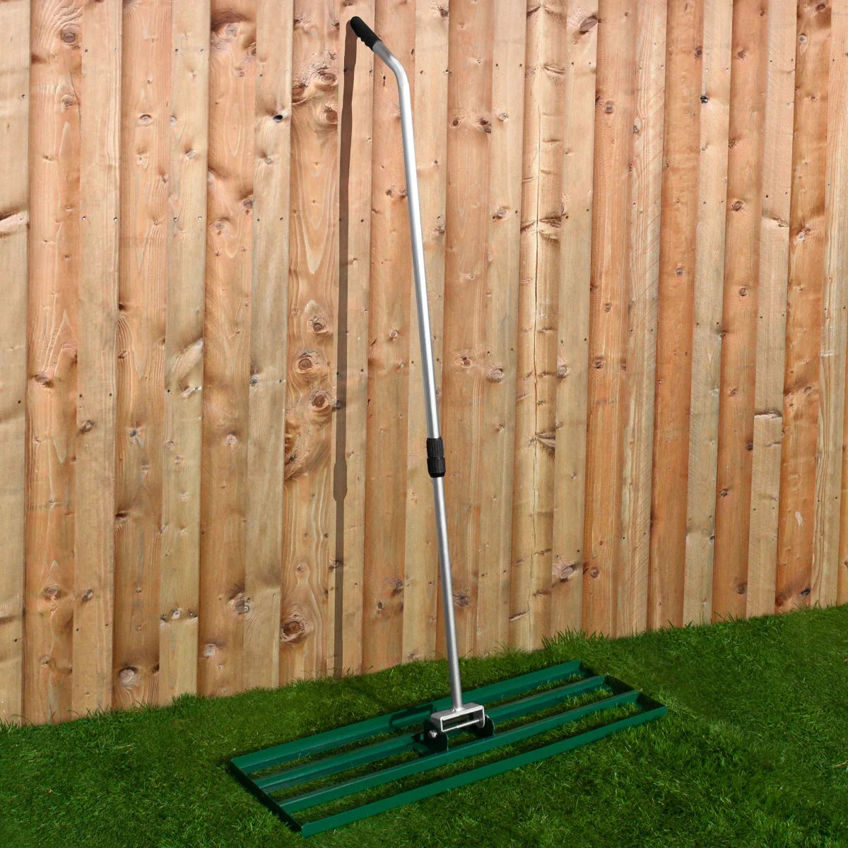 T-Mech Lawn Leveller 100cm in green with a sturdy metal frame and ergonomic handle, ideal for creating a smooth lawn surface