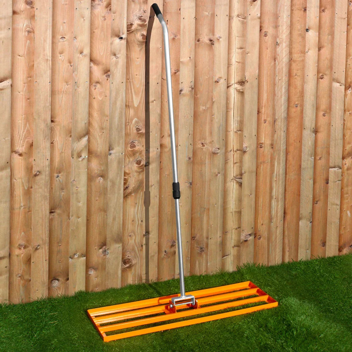 T-Mech Lawn Leveller 100cm in vibrant orange with a sturdy metal handle, designed for leveling soil and creating a smooth lawn surface