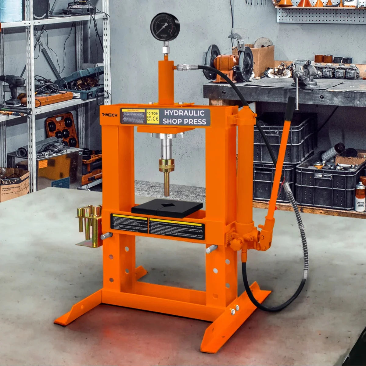 Hydraulic shop press with gauge, 10 tonne capacity, featuring a bright orange frame, sturdy base, and pressure gauge for precise measurements