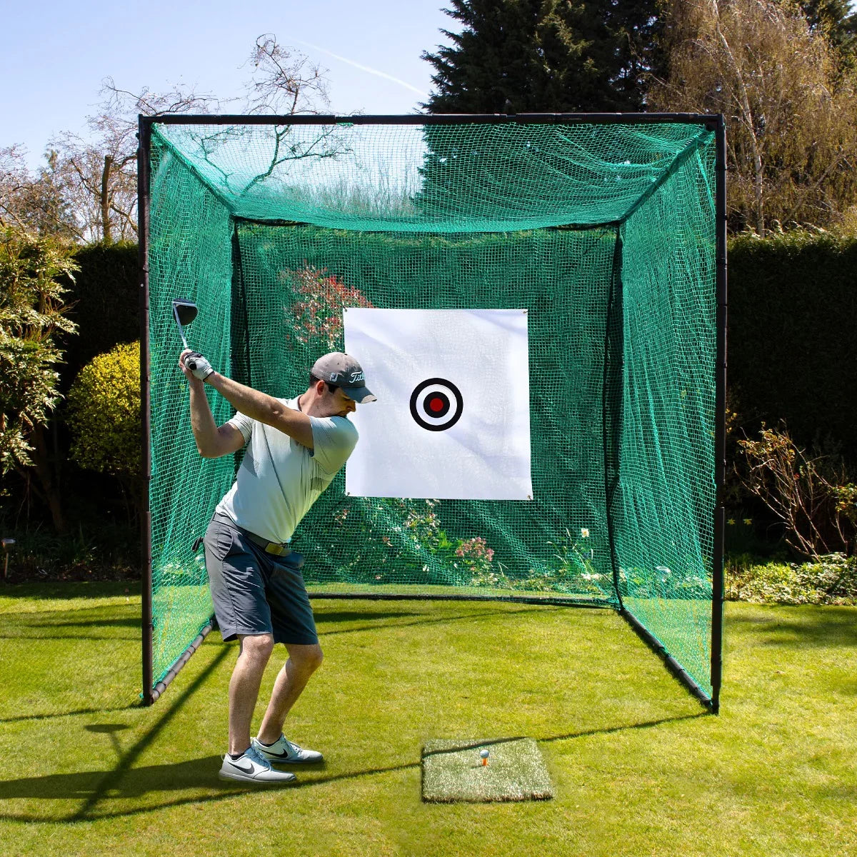 Golf practice cage with green netting, featuring a target, set in a sunny garden, showcasing a golfer preparing to swing