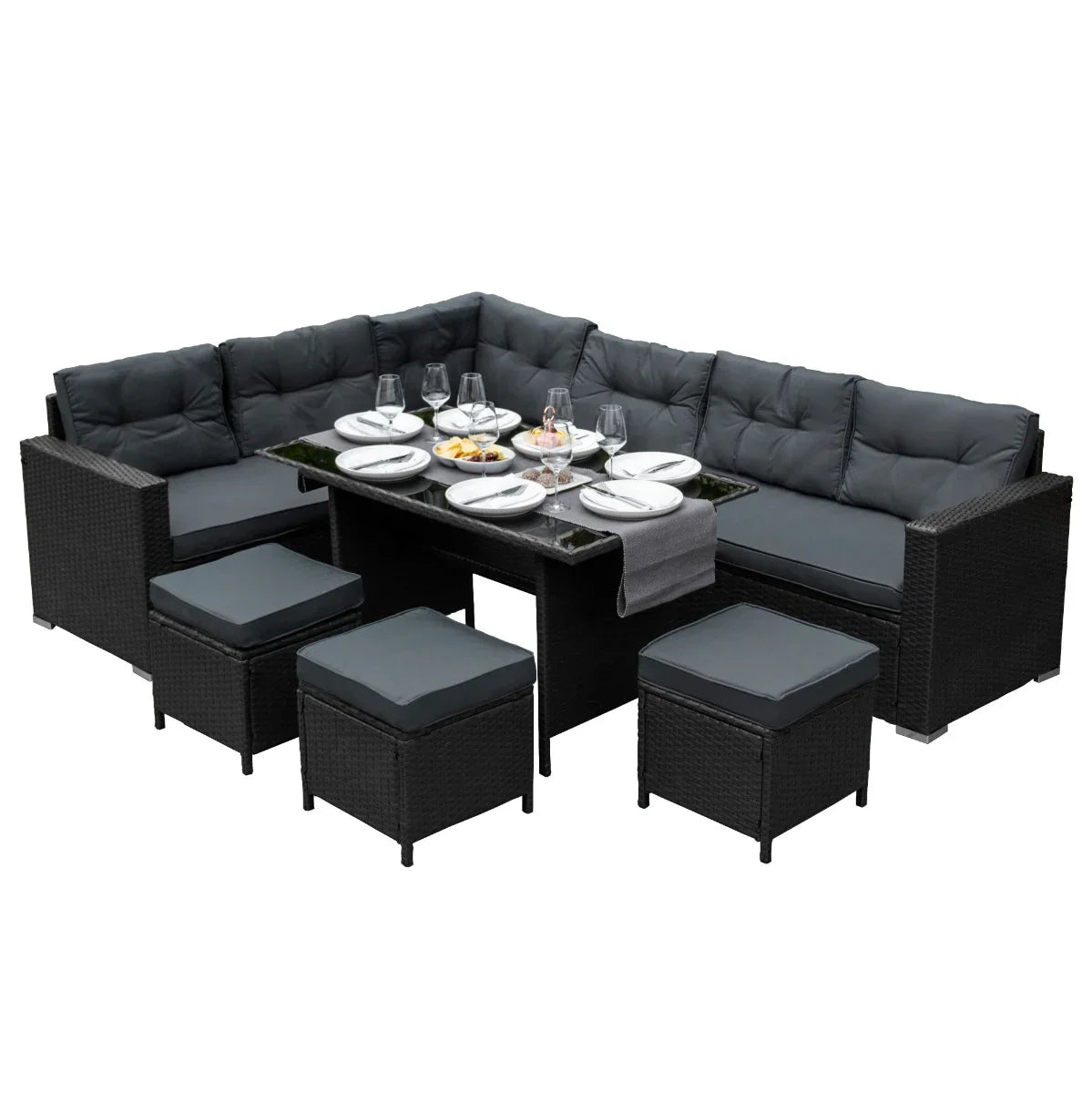 Black rattan corner set featuring plush cushions, a glass-top table, and matching ottomans, perfect for outdoor dining and relaxation