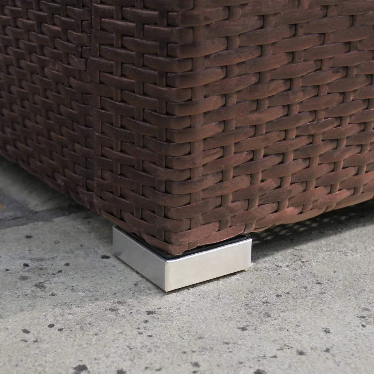 Brown rattan corner set featuring a textured weave and sleek metal feet, ideal for outdoor lounging and enhancing patio aesthetics